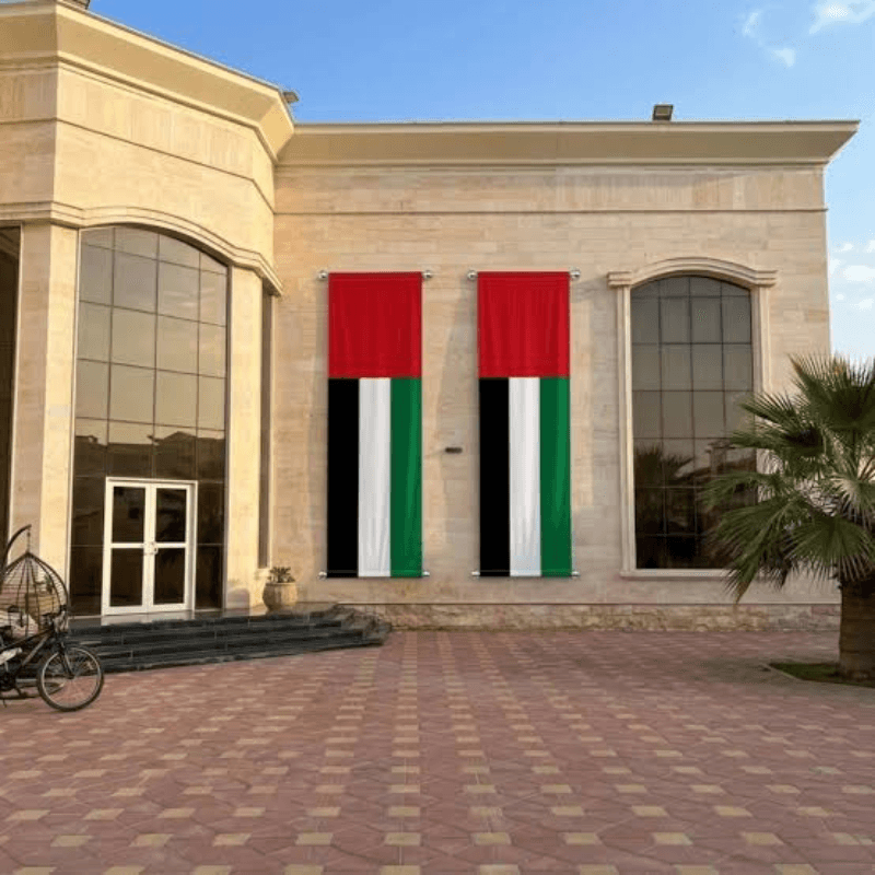 Custom UAE flags installed on a Dubai property by Prime Smart Flags